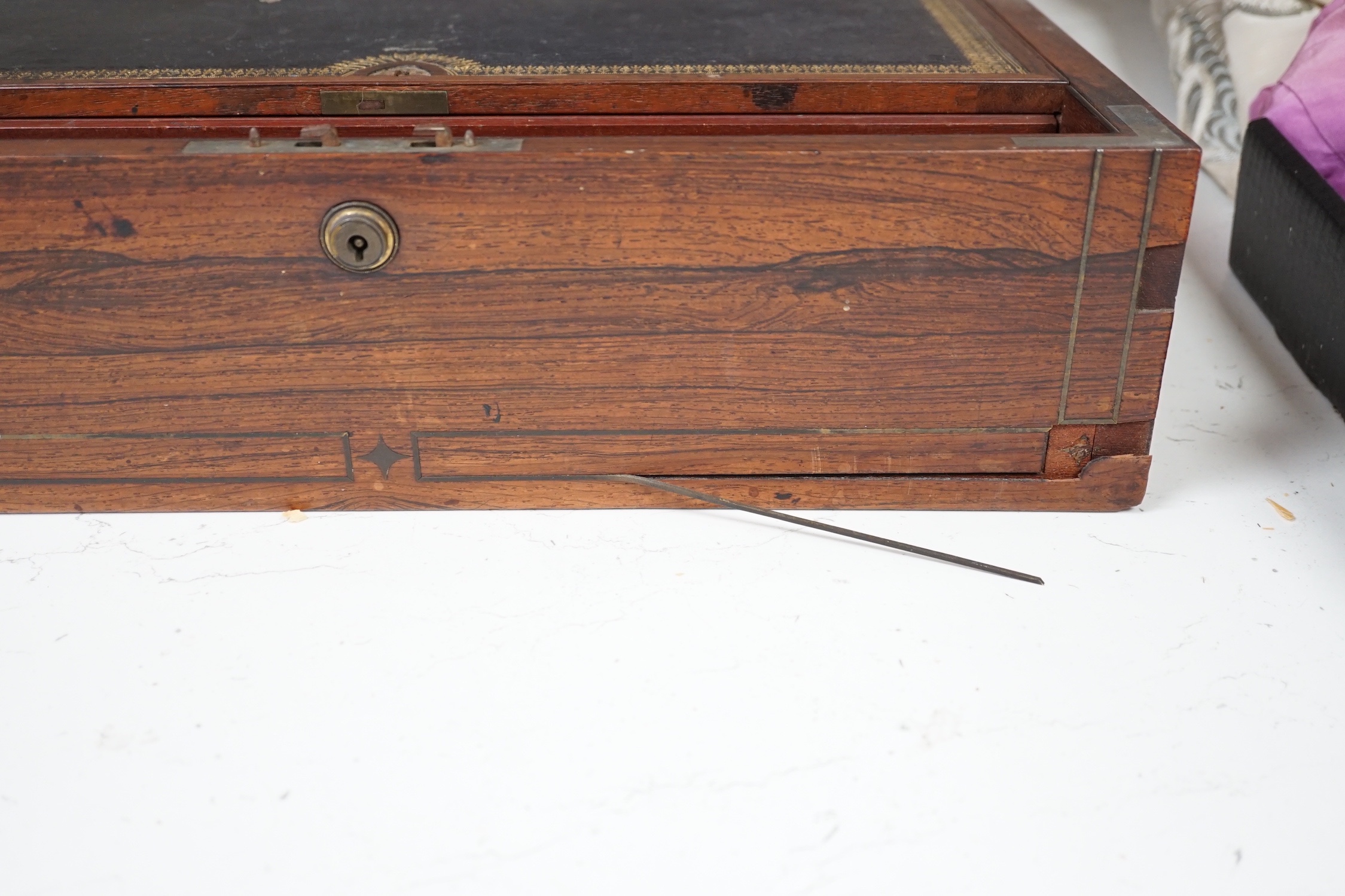 A Victorian rosewood veneered and brass strung writing slope, 43cm